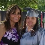 Hispanic Mother and Daughter with Down syndrome in cap and gown