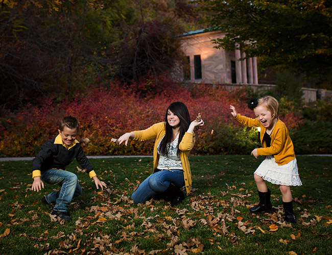 kids family playing in leaves