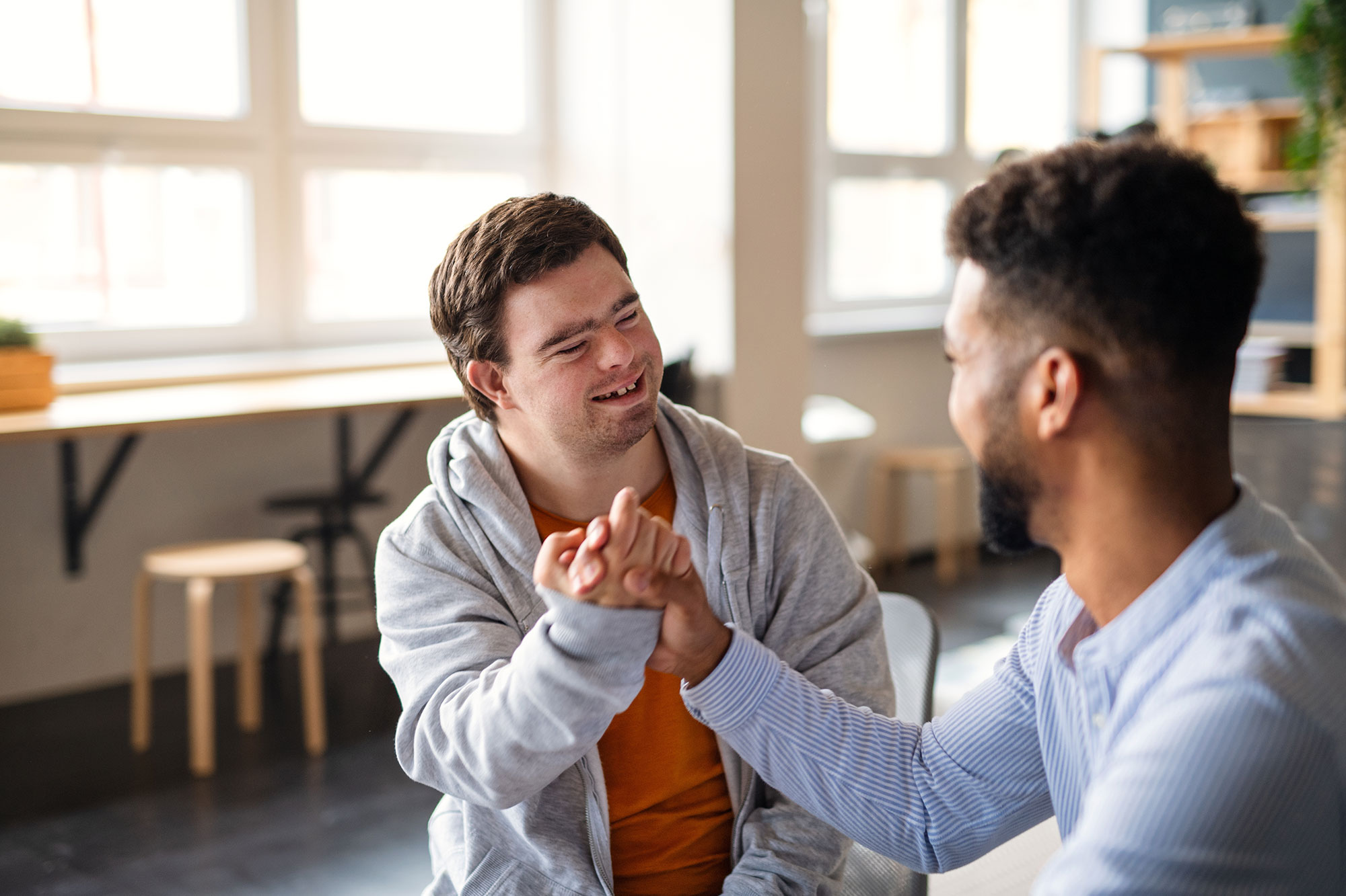 young-happy-man-with-down-syndrome-with-his-mentor01-19-00-15-18-