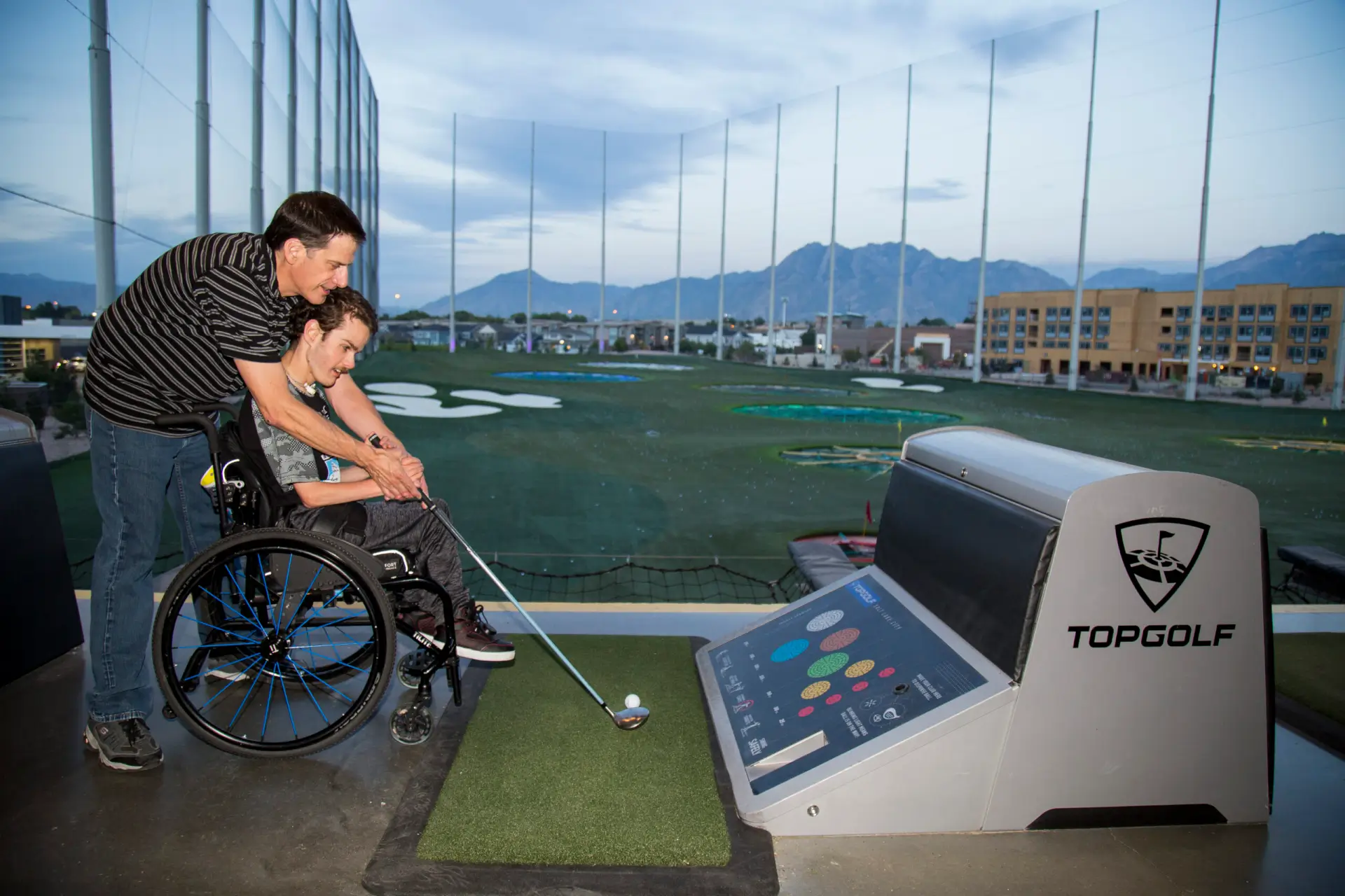 A Utah Parent Center Topgolf fundraiser participant enjoying the event